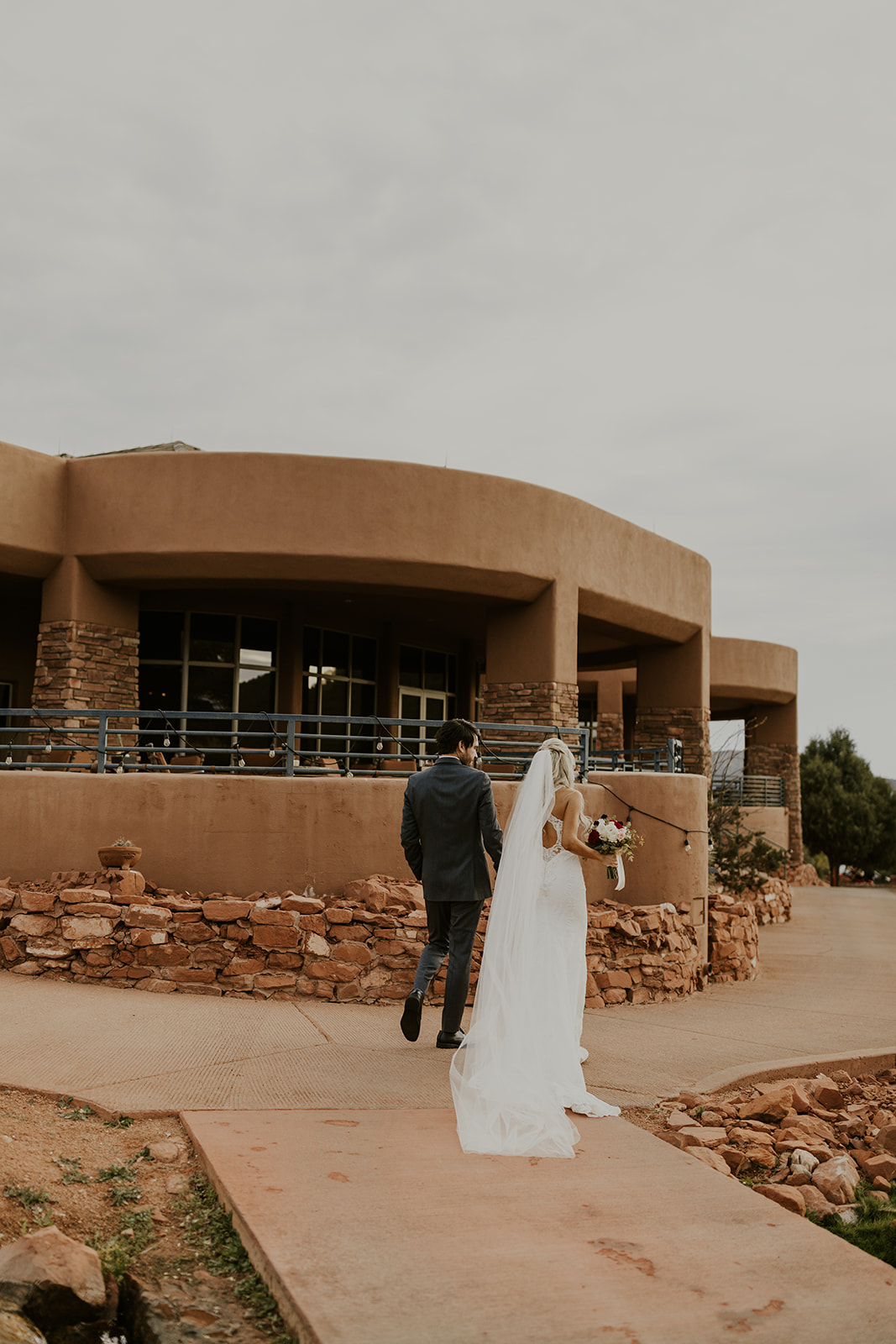 bride and groom walking away after outdoor wedding ceremony