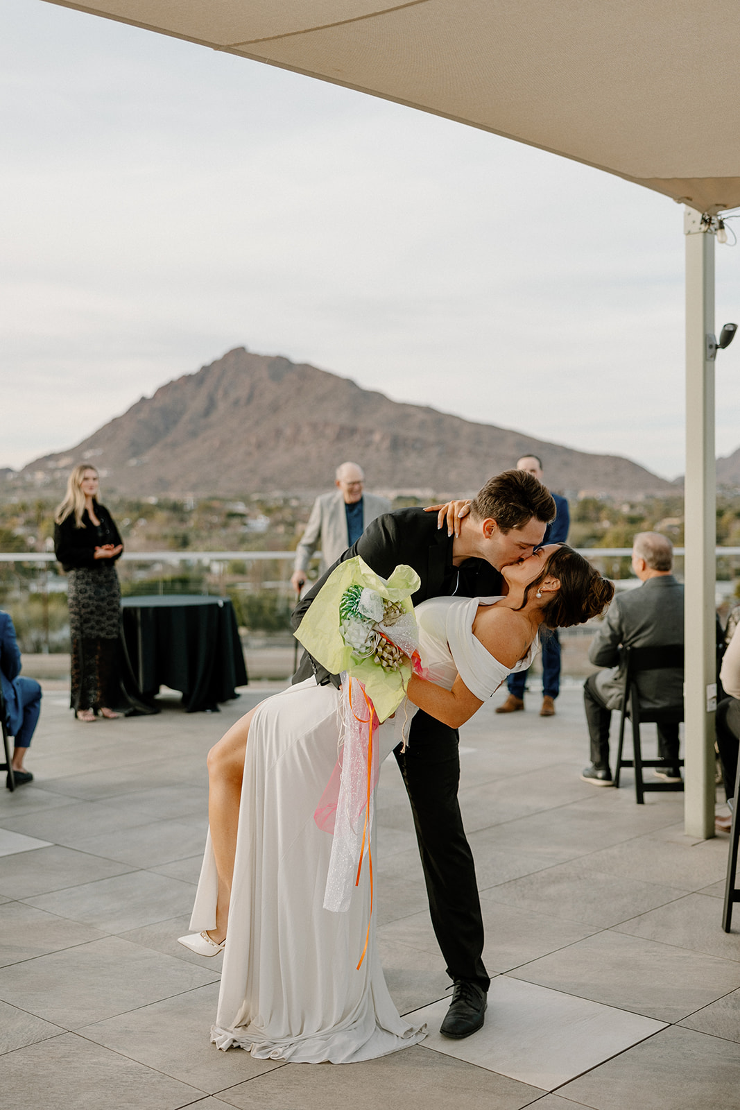 bride and groom dip kiss after rooftop wedding ceremony at Hotel Valley Ho wedding