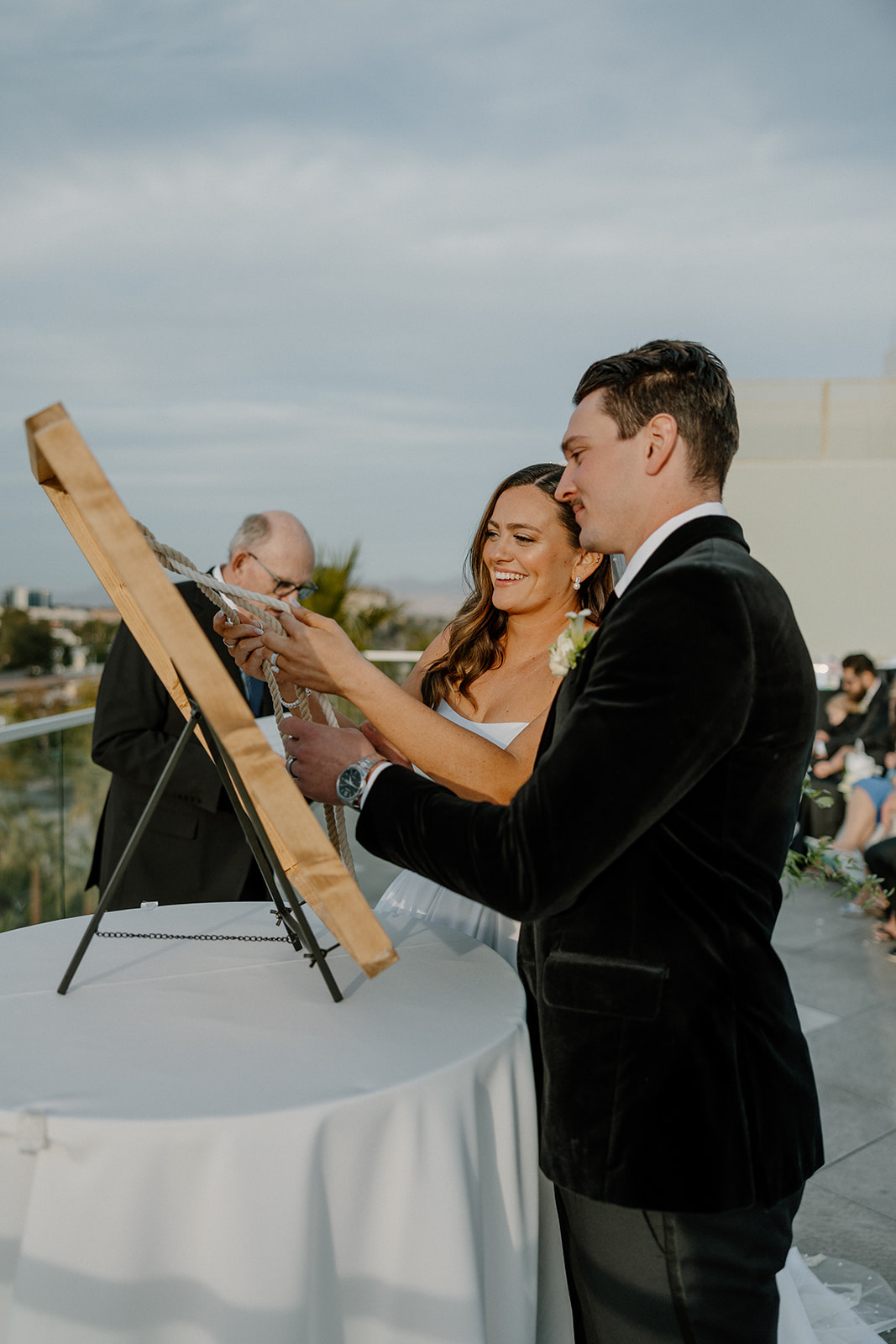 bride and groom tying a knot to signify relationship milestone