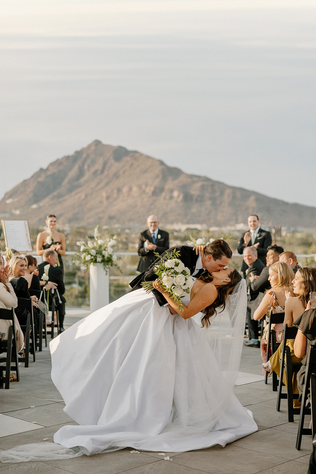bride and groom dip kiss after wedding ceremony at Hotel Valley Ho wedding