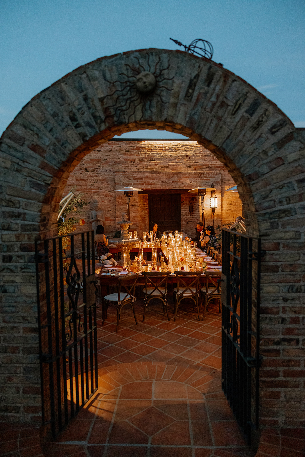 Evening lit dinner reception with brick archway at Eagle Dancer a top wedding venue in Sedona