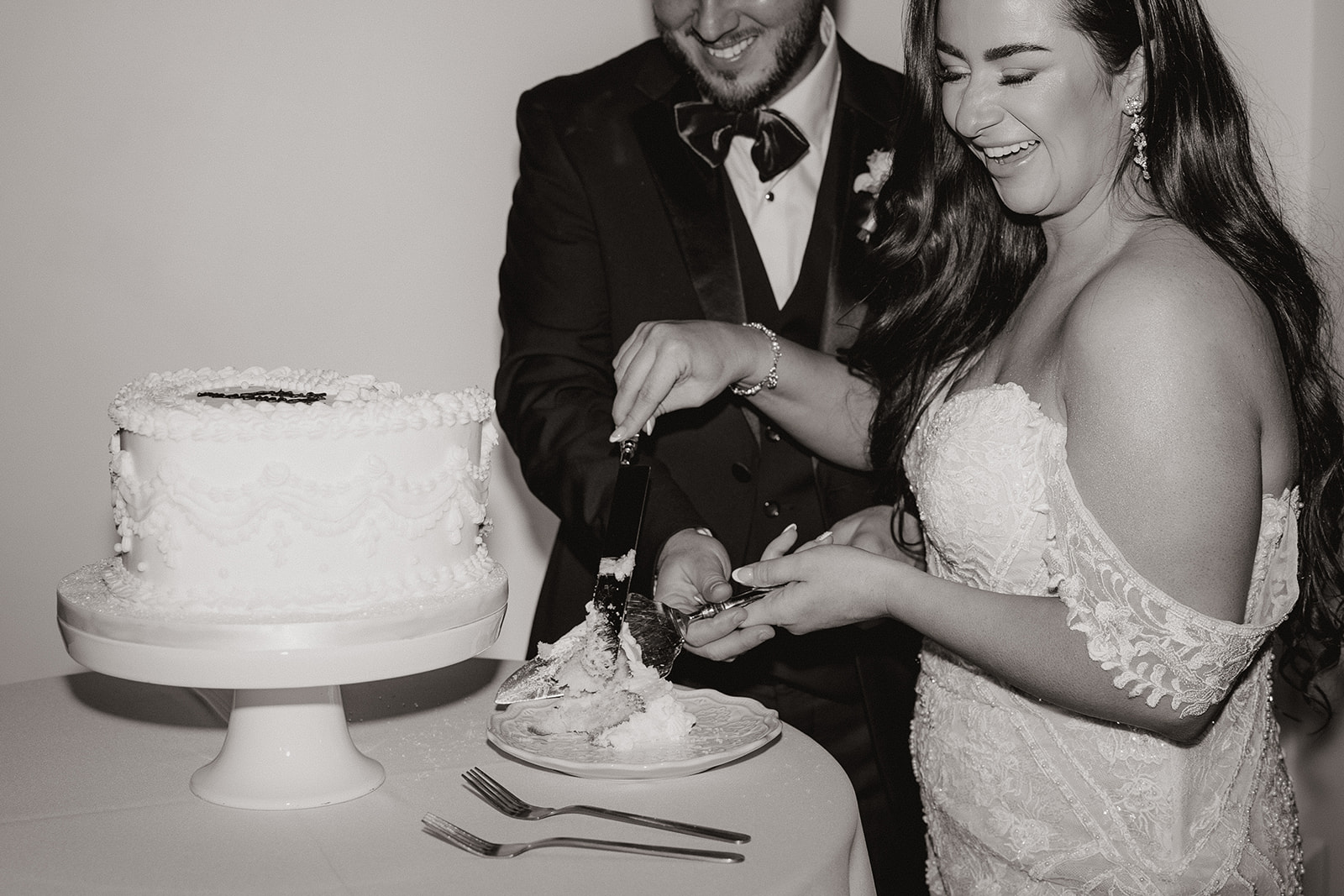 bride and groom cut their wedding cake