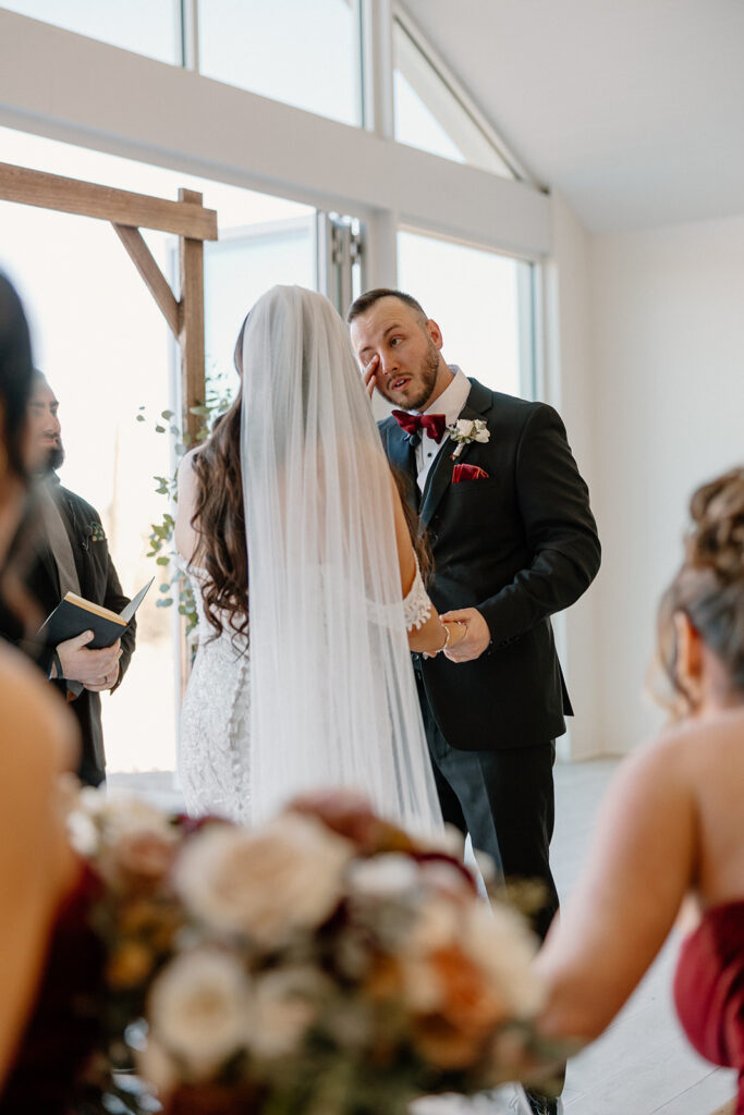 groom sheds a tear during an emotional wedding ceremony At desert view's chapel in Arizona
