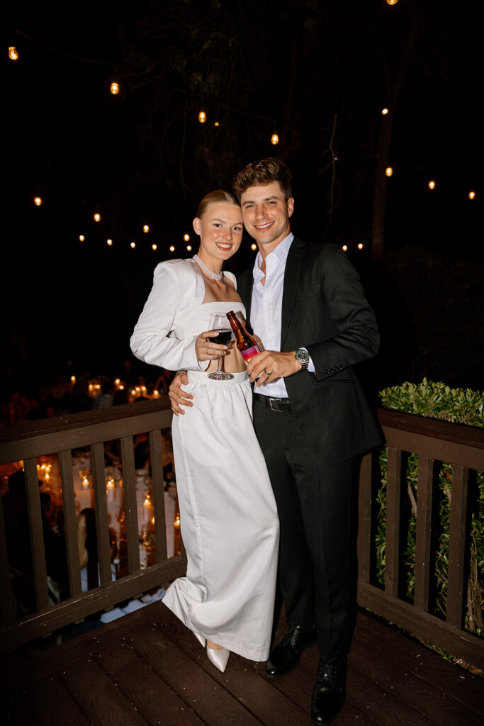 Bride and groom hugging and celebrating recent marriage at reception