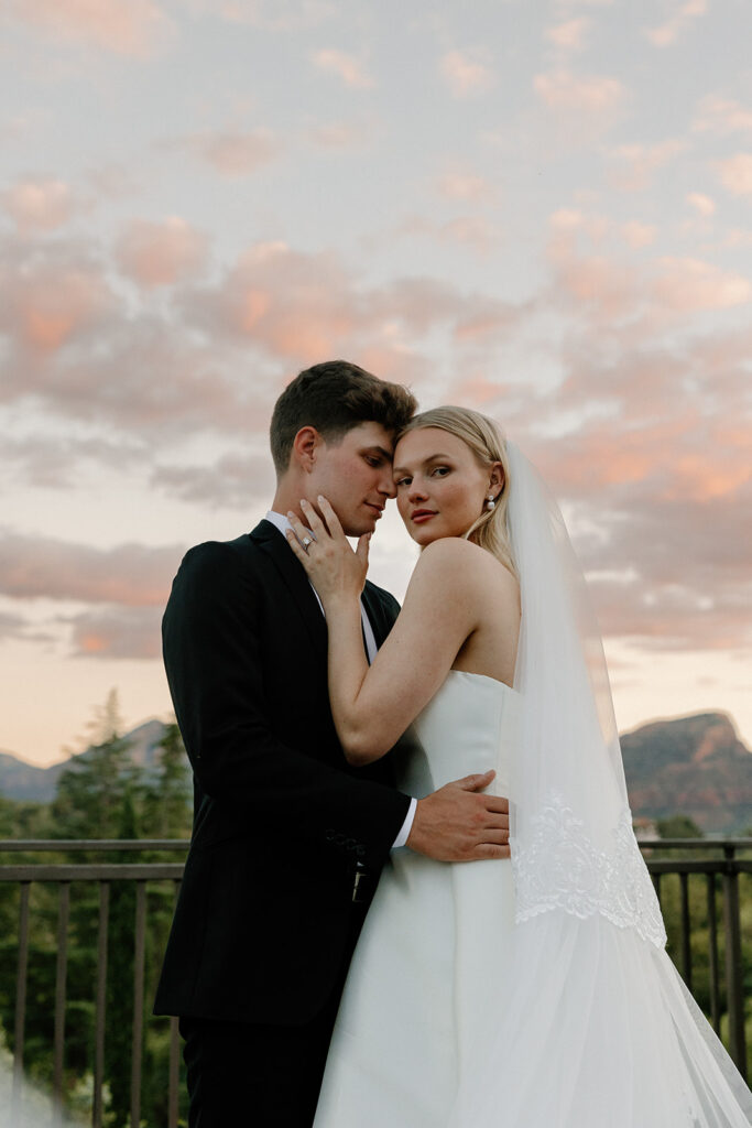 bride and groom embracing at top wedding venues in sedona during sunset