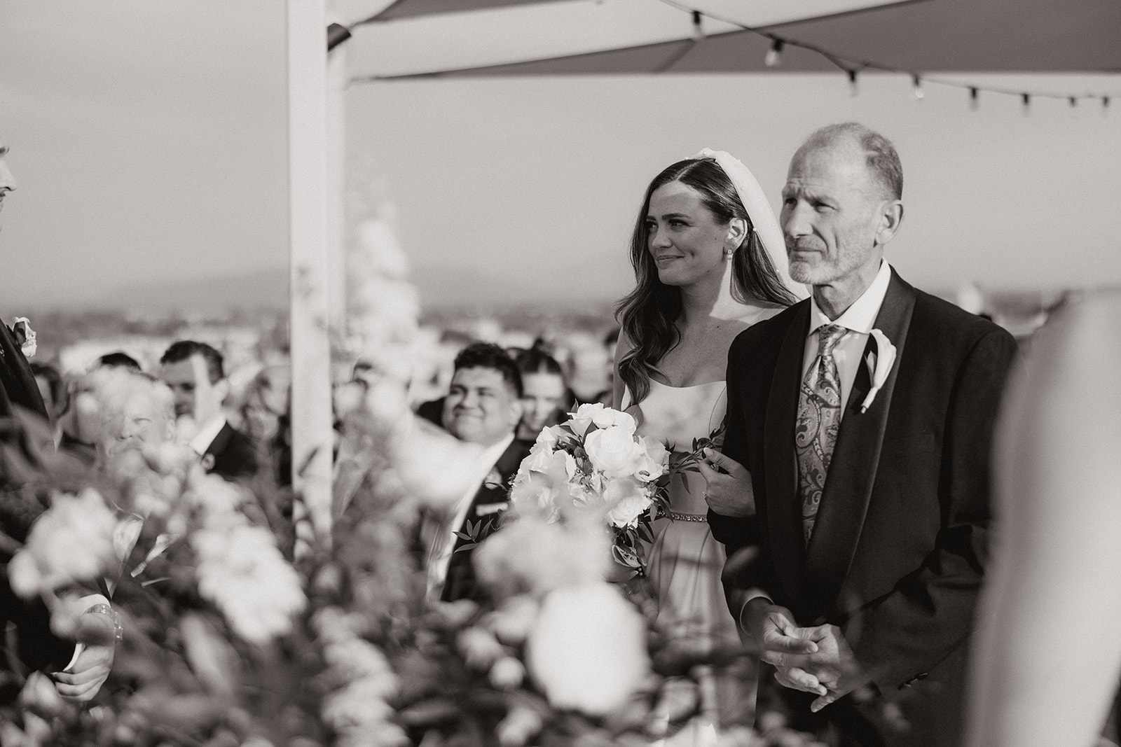 bride being walked down aisle by father