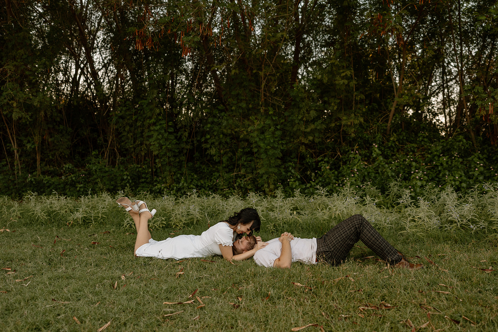 beautiful couple share intimate moments together in the greenery during their Mesa Arizona Engagement Photos