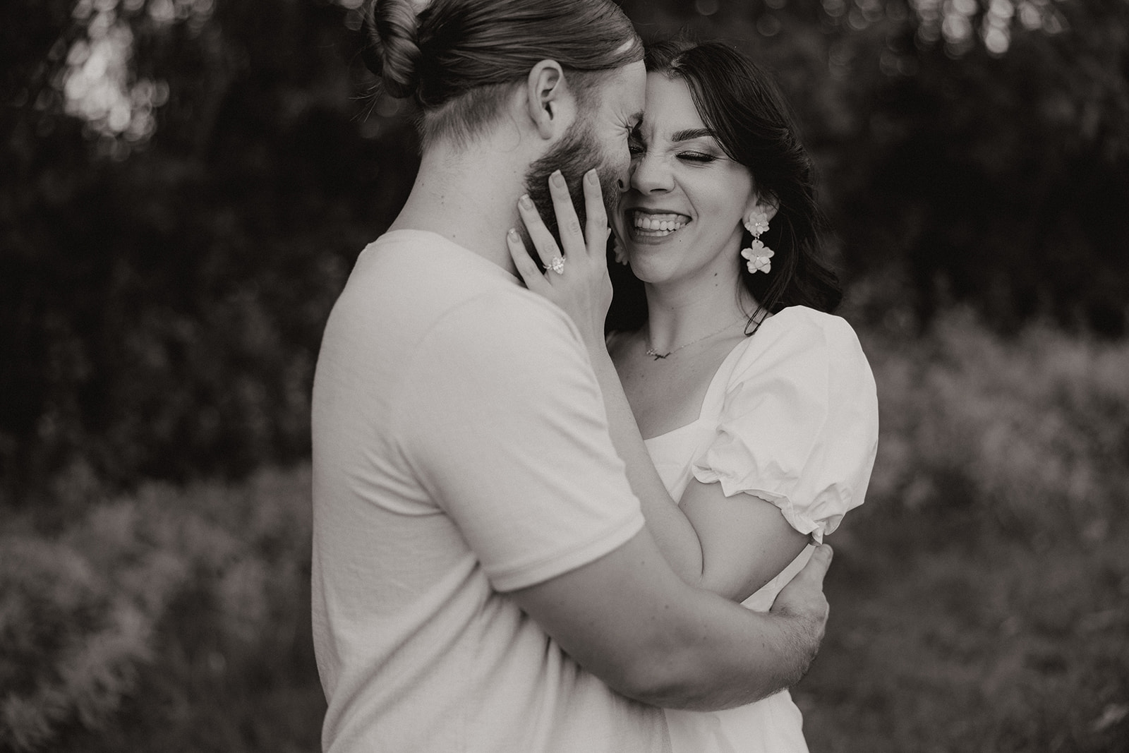 beautiful couple share a laugh during their Arizona engagement photoshoot