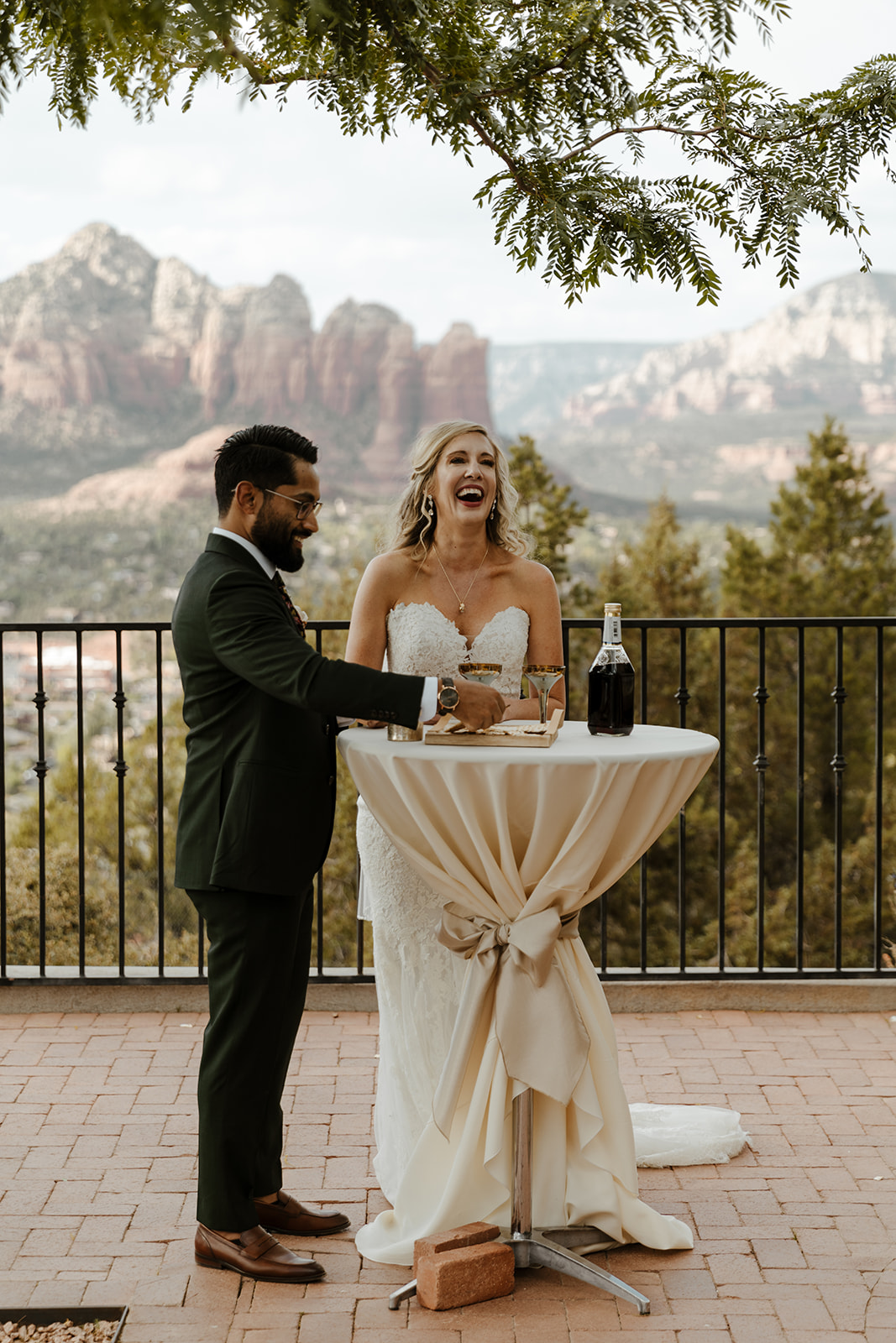 Bride and groom laughing after signing marriage license and celebrating