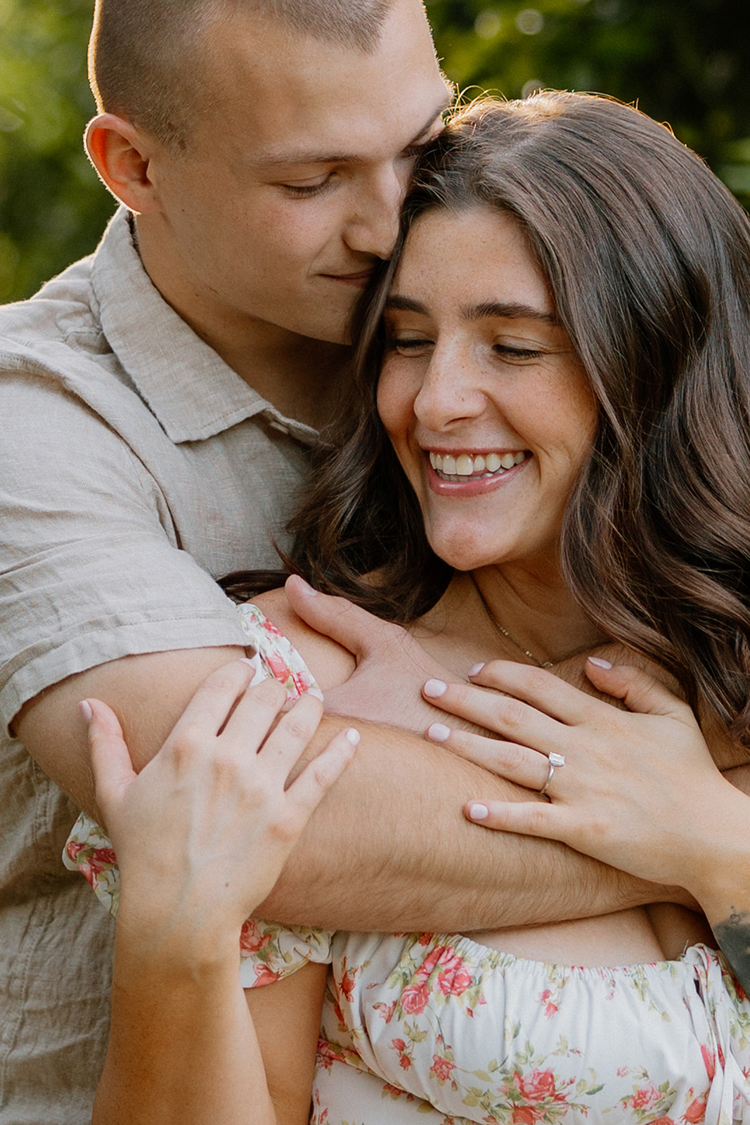 Newly engaged couple embracing in Orange Orchard during engagement photos in Arizona