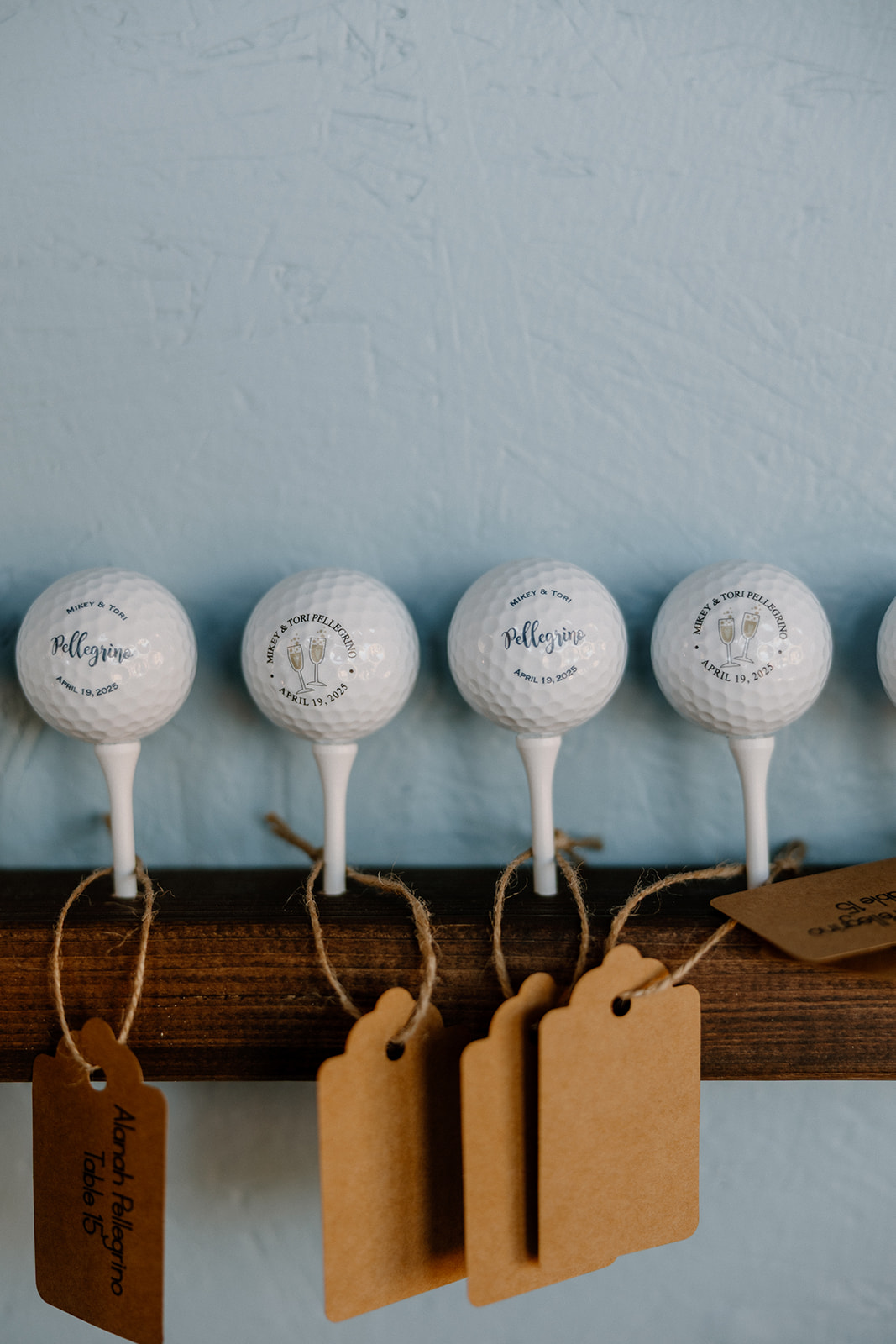 Custom golf balls with the couple’s logo double as escort cards, tagged with guest names—sporty, sweet, and totally on theme.