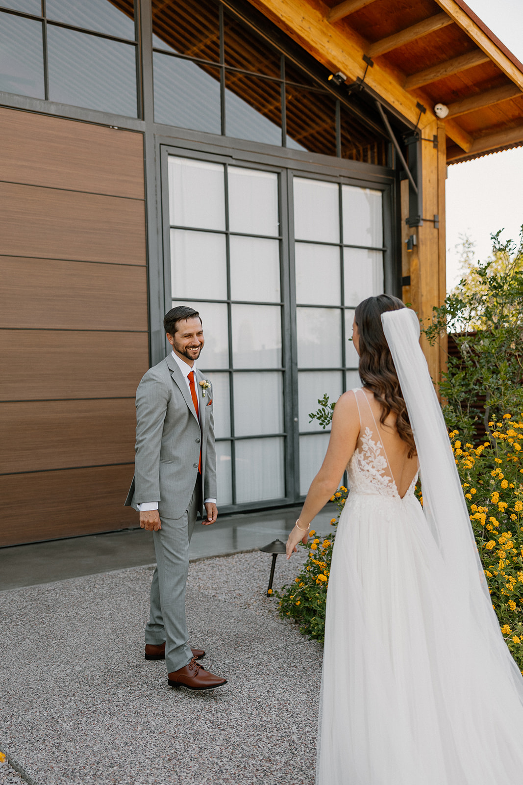 The groom’s emotional reaction as he sees the bride for the first time during their first look at The Paseo.