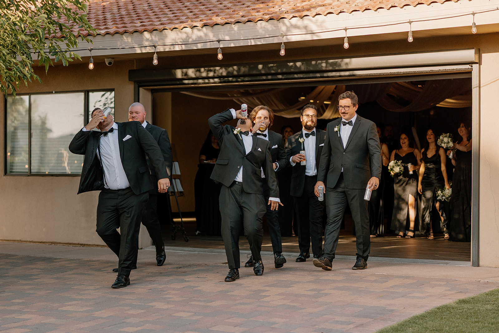The groomsmen bring the hype as they make a rowdy, hilarious entrance into the reception at their Arizona wedding venue.