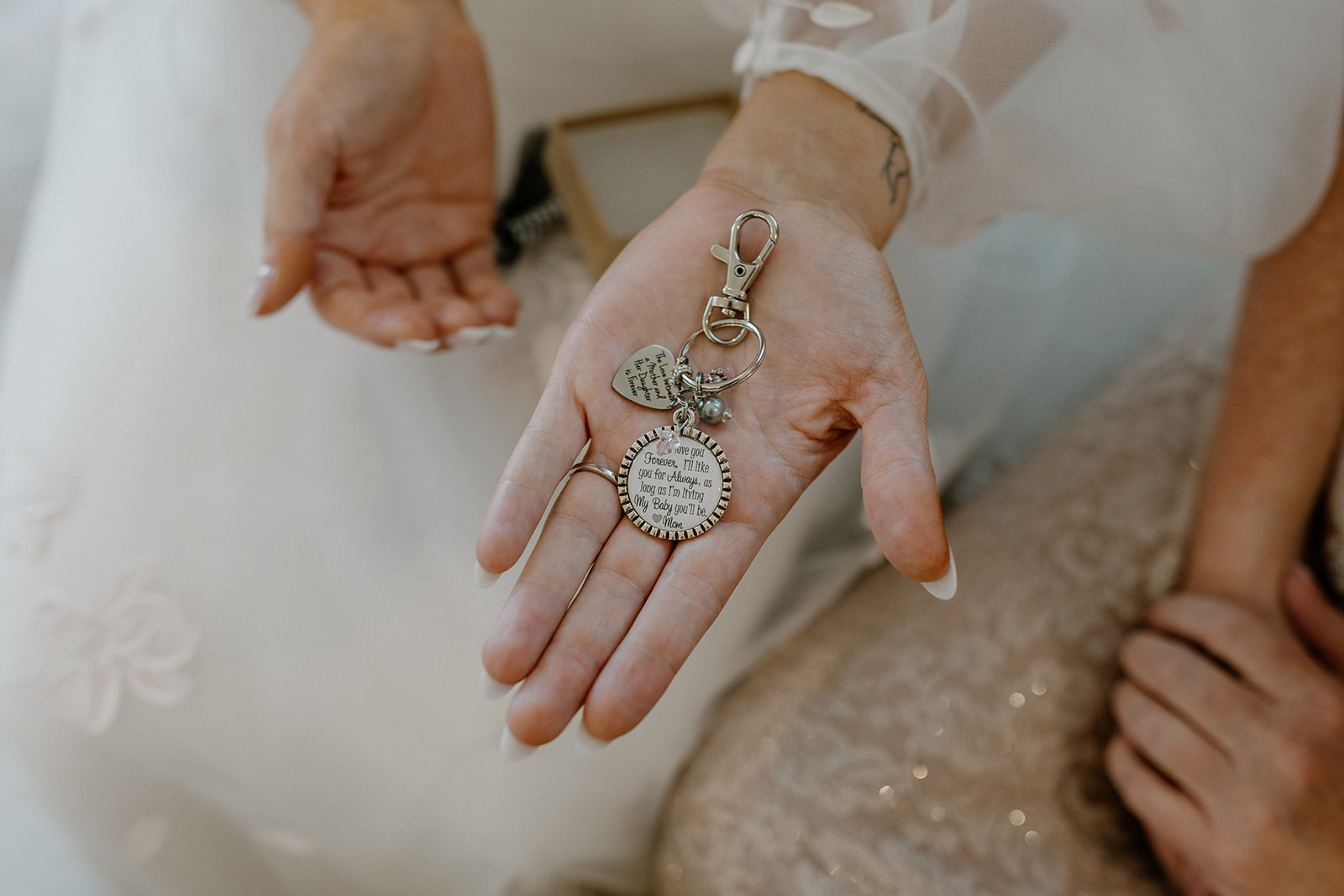 Close up of custom bouquet charm for bride to remember her loved ones that have passed away. 