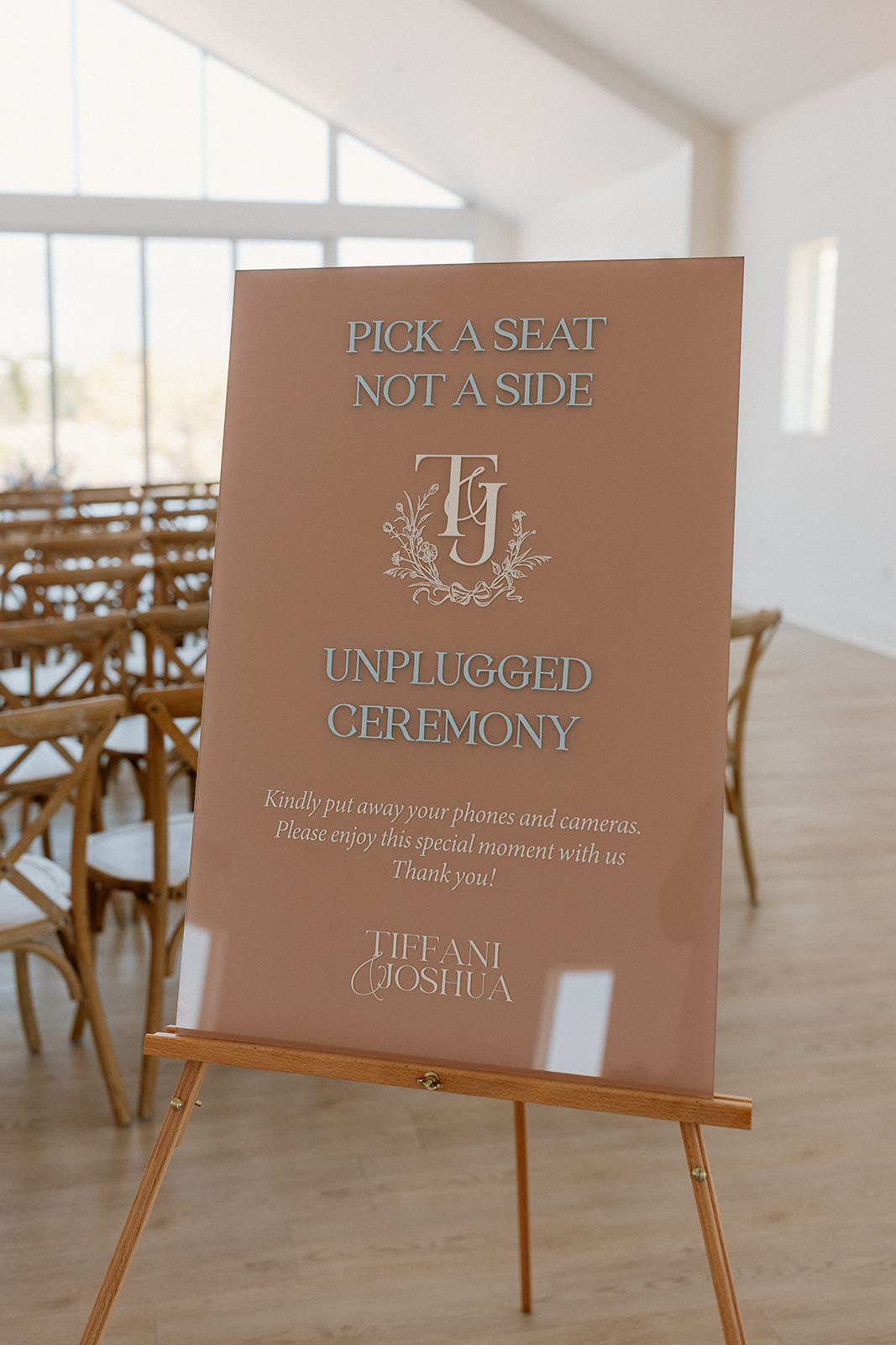 Custom wedding signage on terracota acrylic sign encouraging guests to turn off phones and be in the moment. 