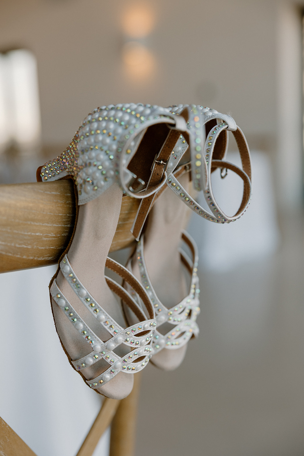 Close-up of sparkly bridal sandals with pearl embellishments — wedding planning guide detail perfection.