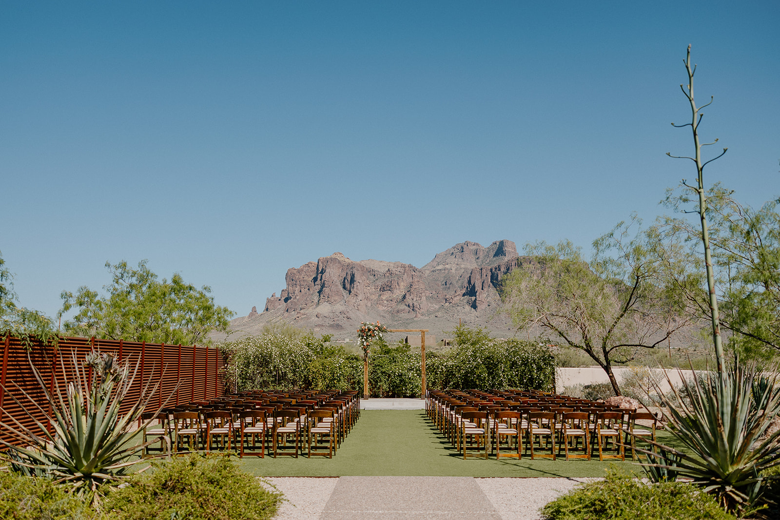 Empty ceremony setup facing Superstition Mountains, capturing the iconic desert beauty of wedding venues in Arizona.