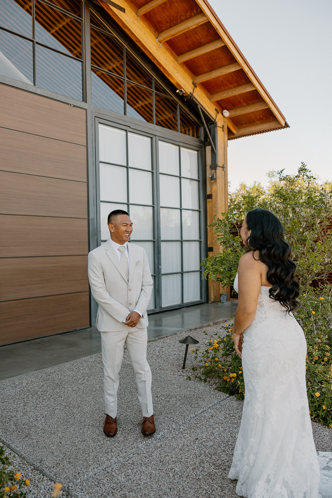 The groom turning around with a huge smile during the couple’s first look, moments before the ceremony.