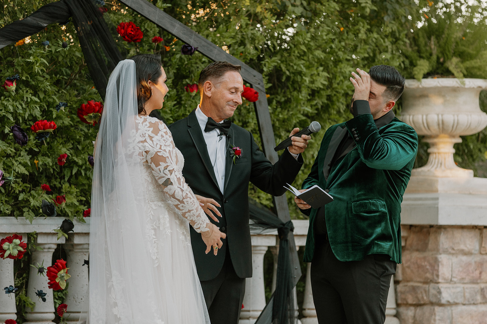 Groom reading handwritten vows during the ceremony at a wedding venue in Chandler.