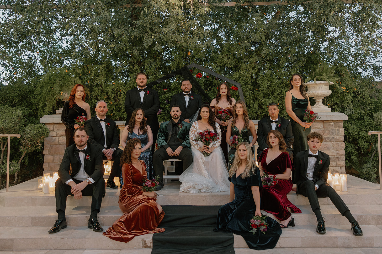 Full wedding party portrait on ceremony steps at a wedding venue in Chandler.