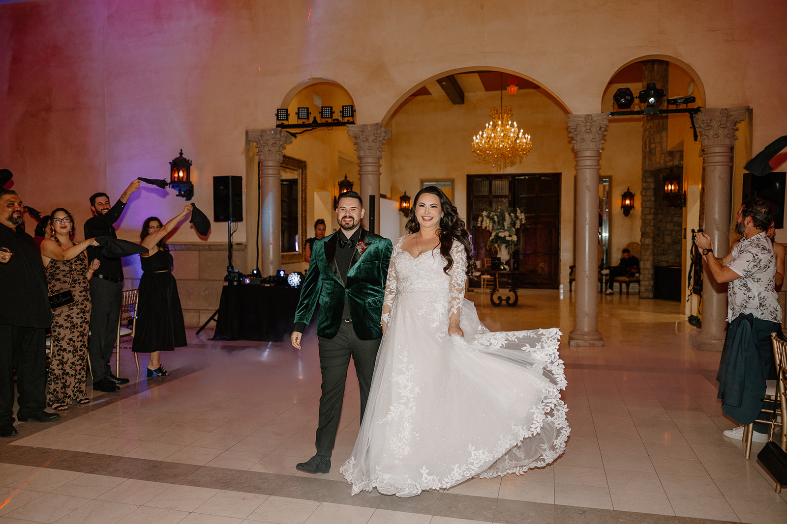 Bride and groom making their grand entrance into the reception at a wedding venue in Chandler.