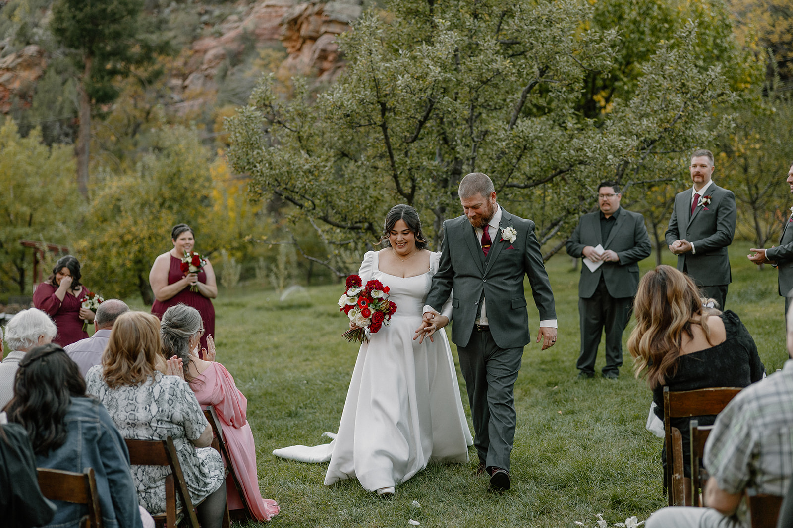 Newly married couple walking back down the aisle after their ceremony at a Sedona wedding venue