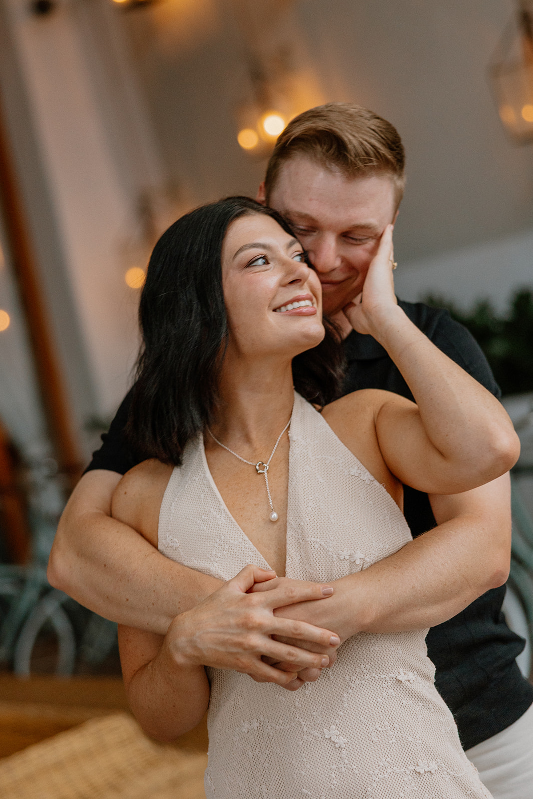 Close-up of couple embracing during an intimate engagement session moment