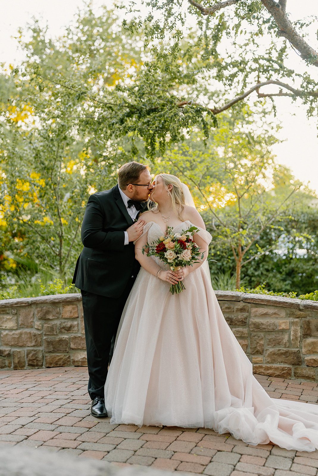Romantic wedding portrait on the green lawn at Stonebridge Manor Wedding Venue