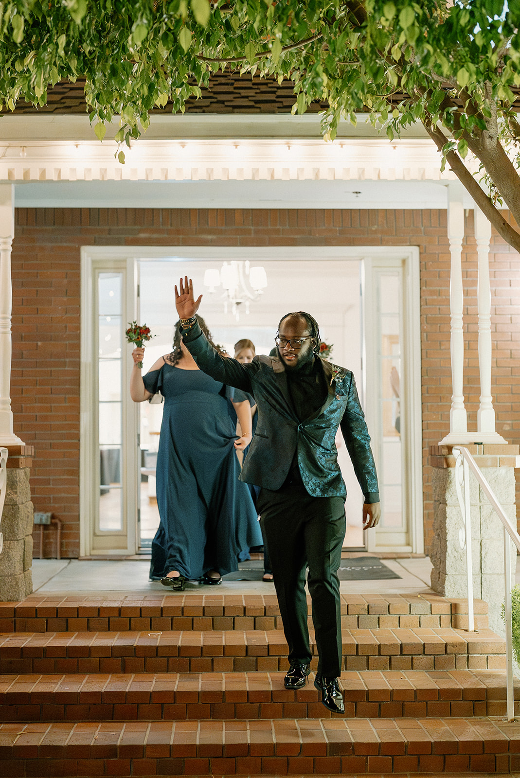 Wedding party entrance down the steps at Stonebridge Manor Wedding Venue reception