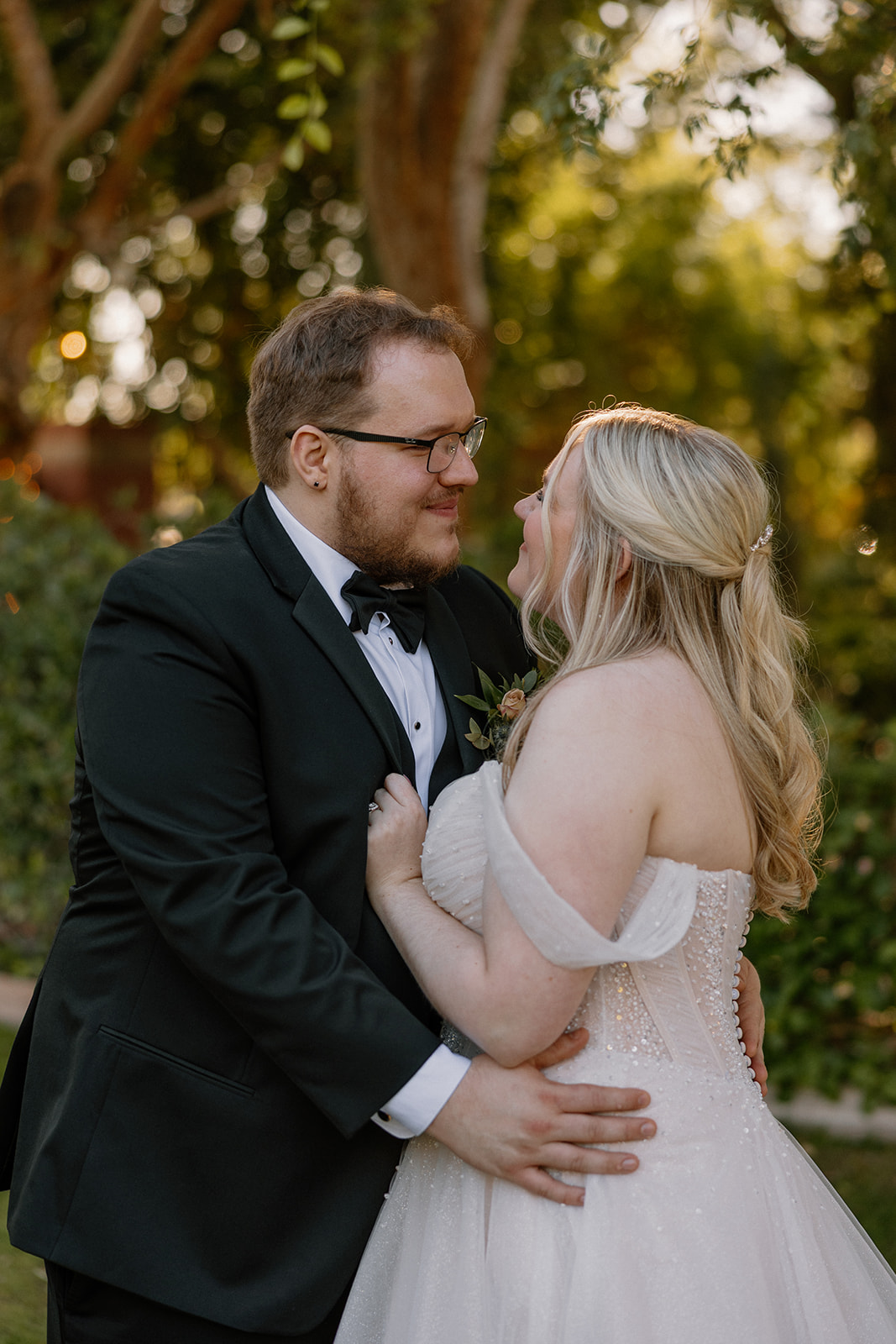 Bride and groom sharing a quiet moment during portraits at Stonebridge Manor Wedding Venue