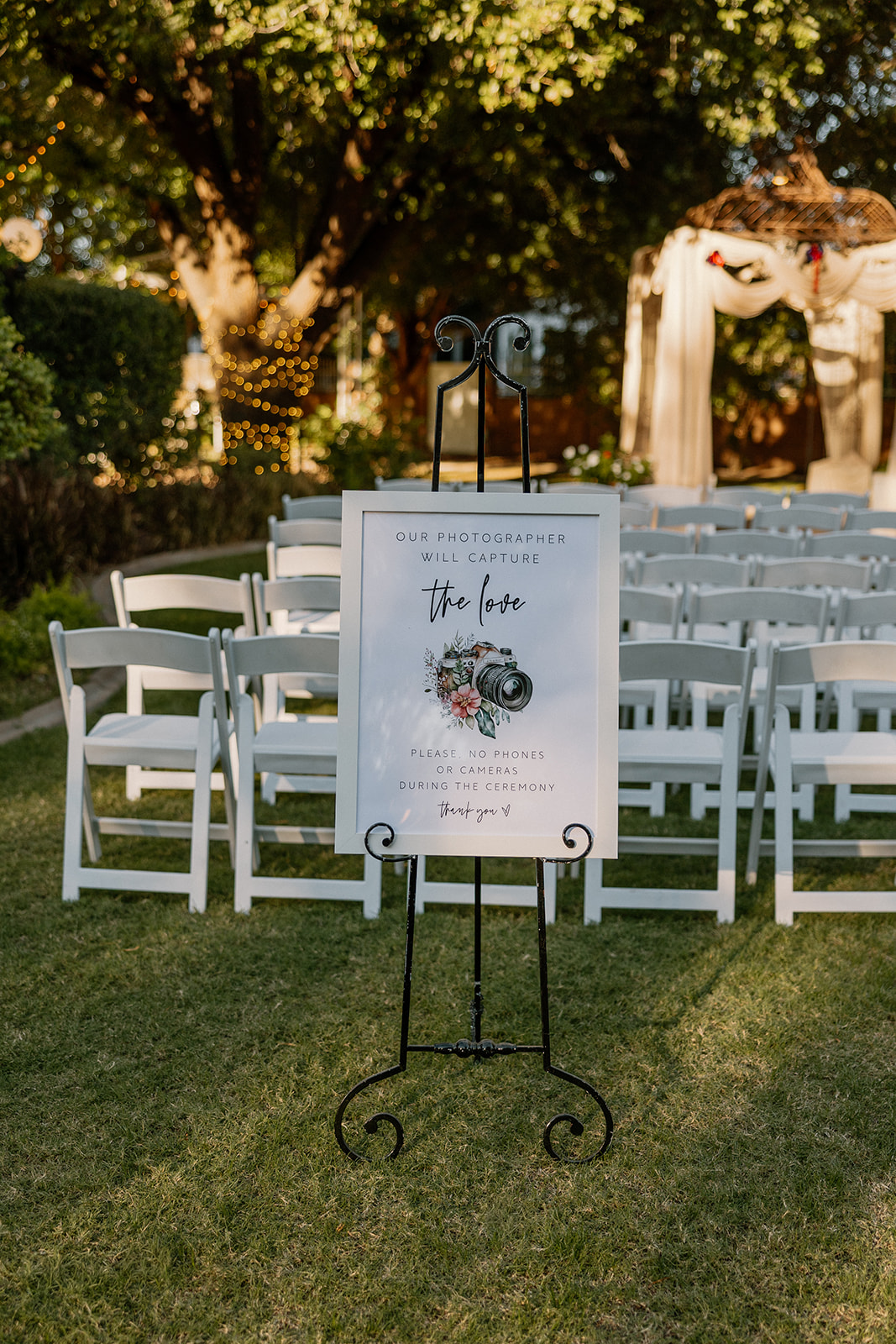 Unplugged ceremony sign placed at aisle entrance at Stonebridge Manor Wedding Venue