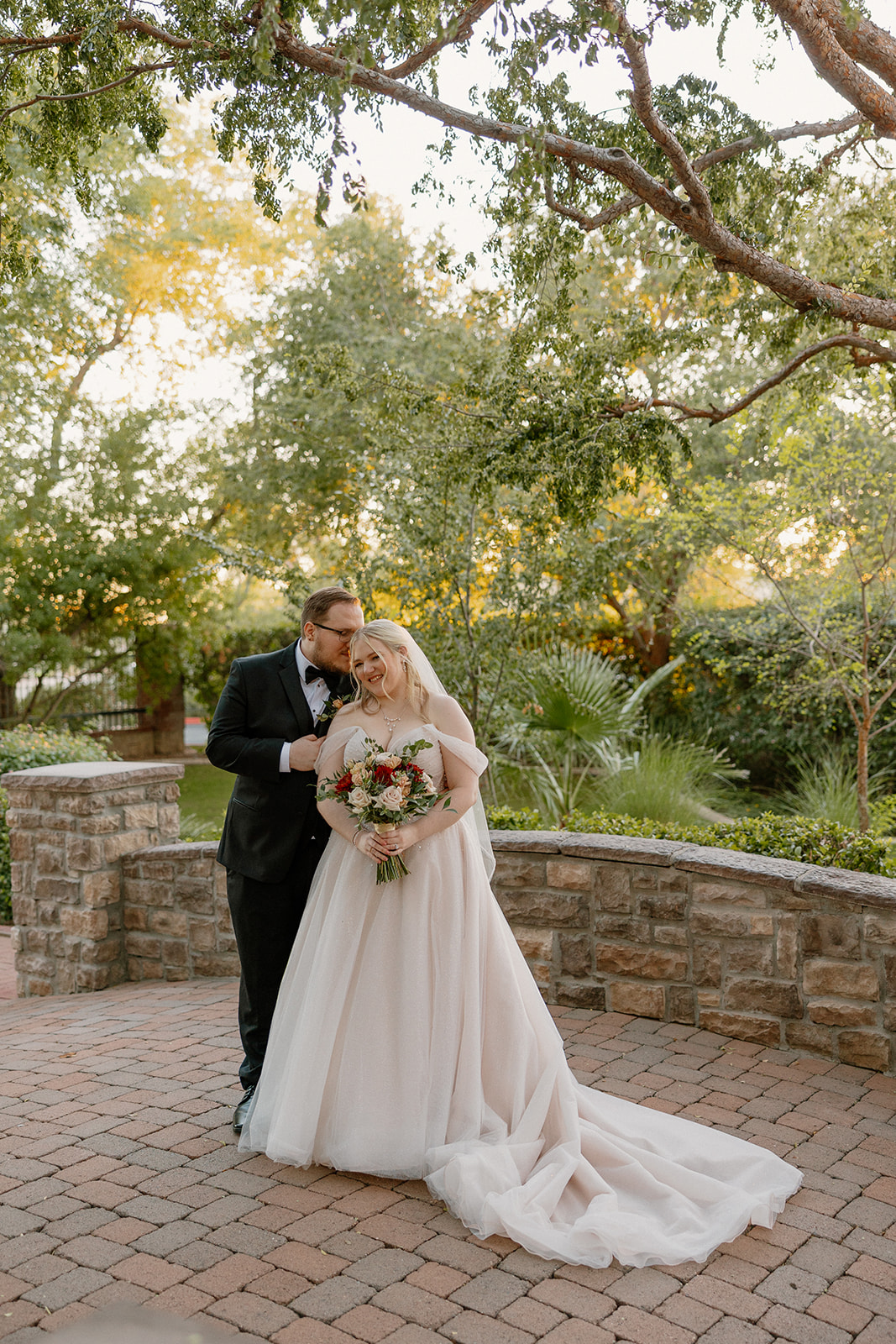 Bride and groom portrait in the garden courtyard at Stonebridge Manor Wedding Venue