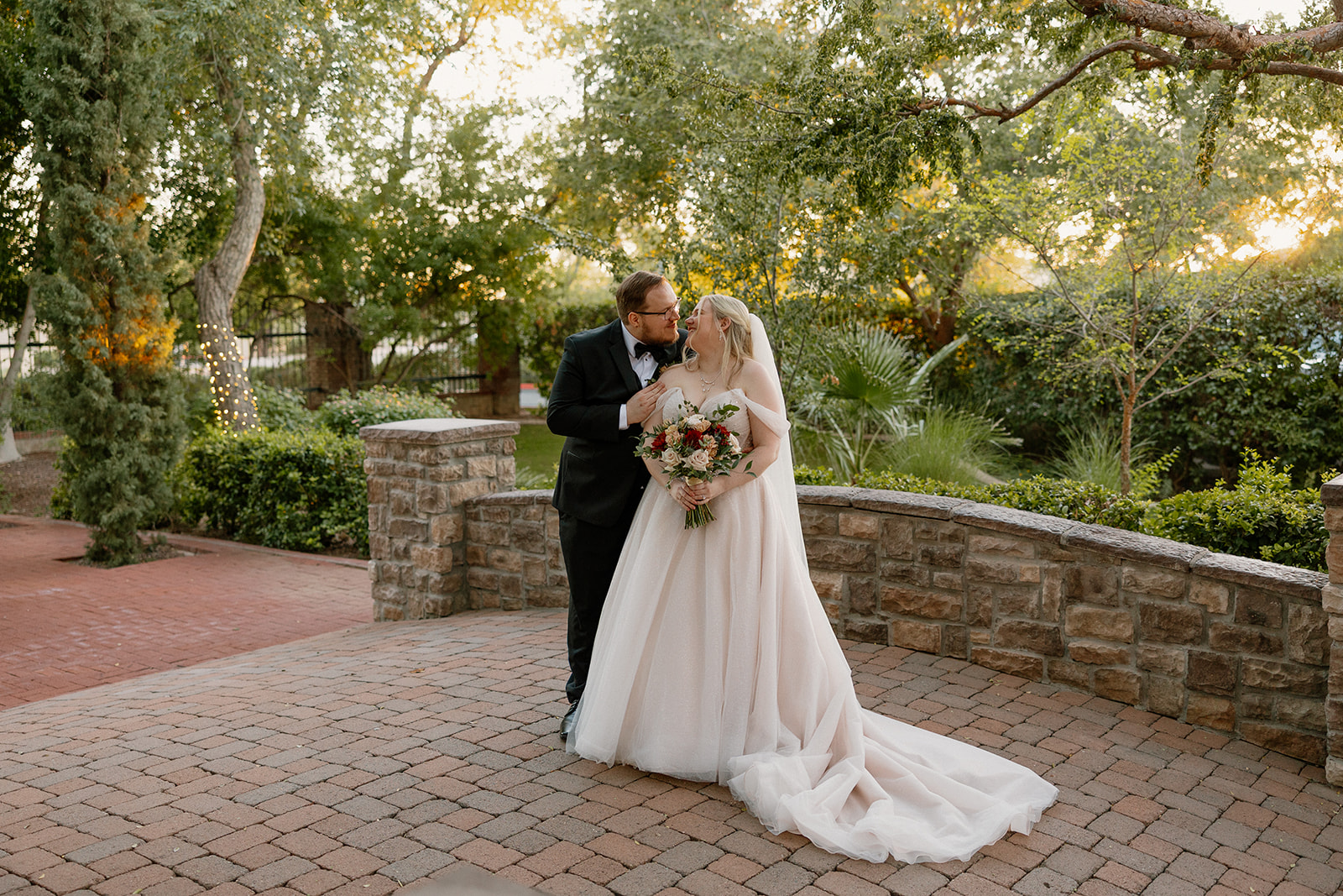 Bride and groom portraits in the garden courtyard at Stonebridge Manor Wedding Venue