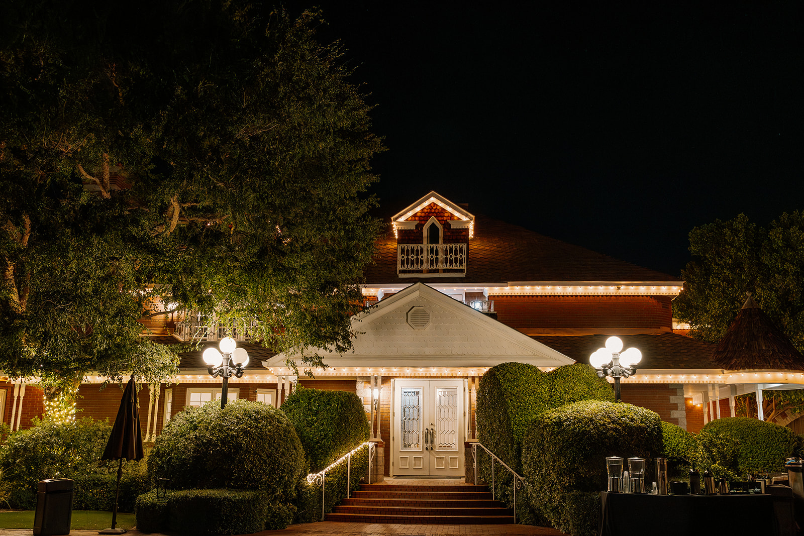 Stonebridge Manor Wedding Venue exterior lit up at night in Mesa Arizona