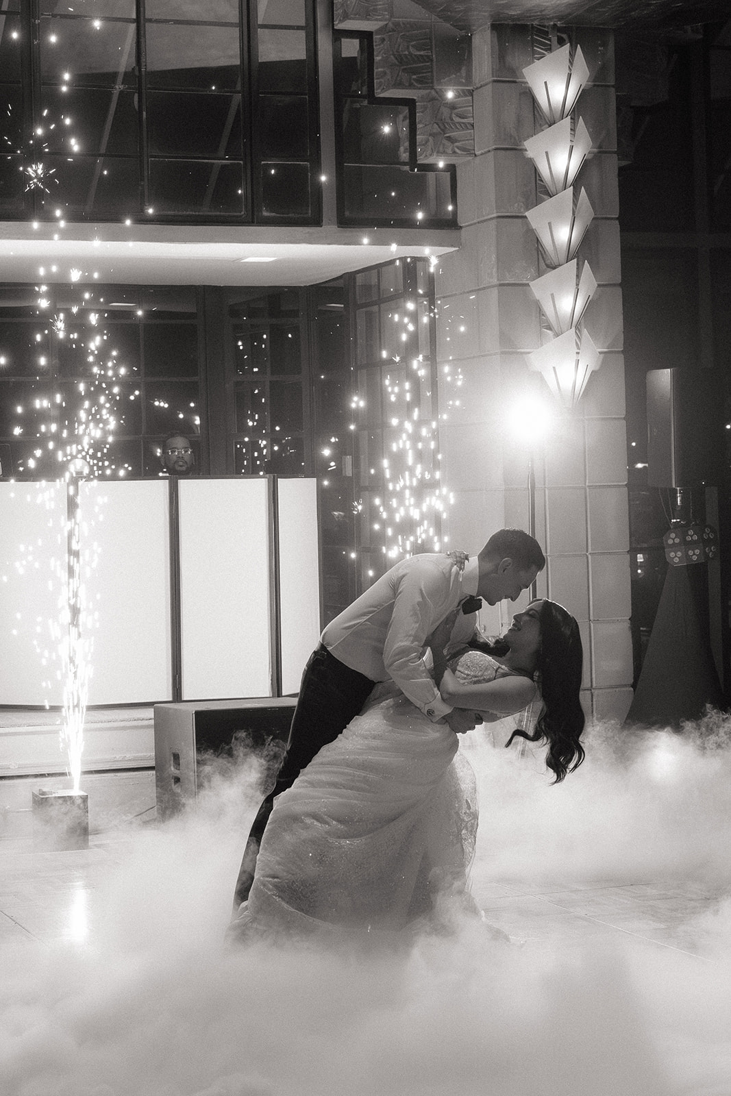 Bride and groom sharing a first dance with cold sparks and low fog during their Biltmore wedding reception
