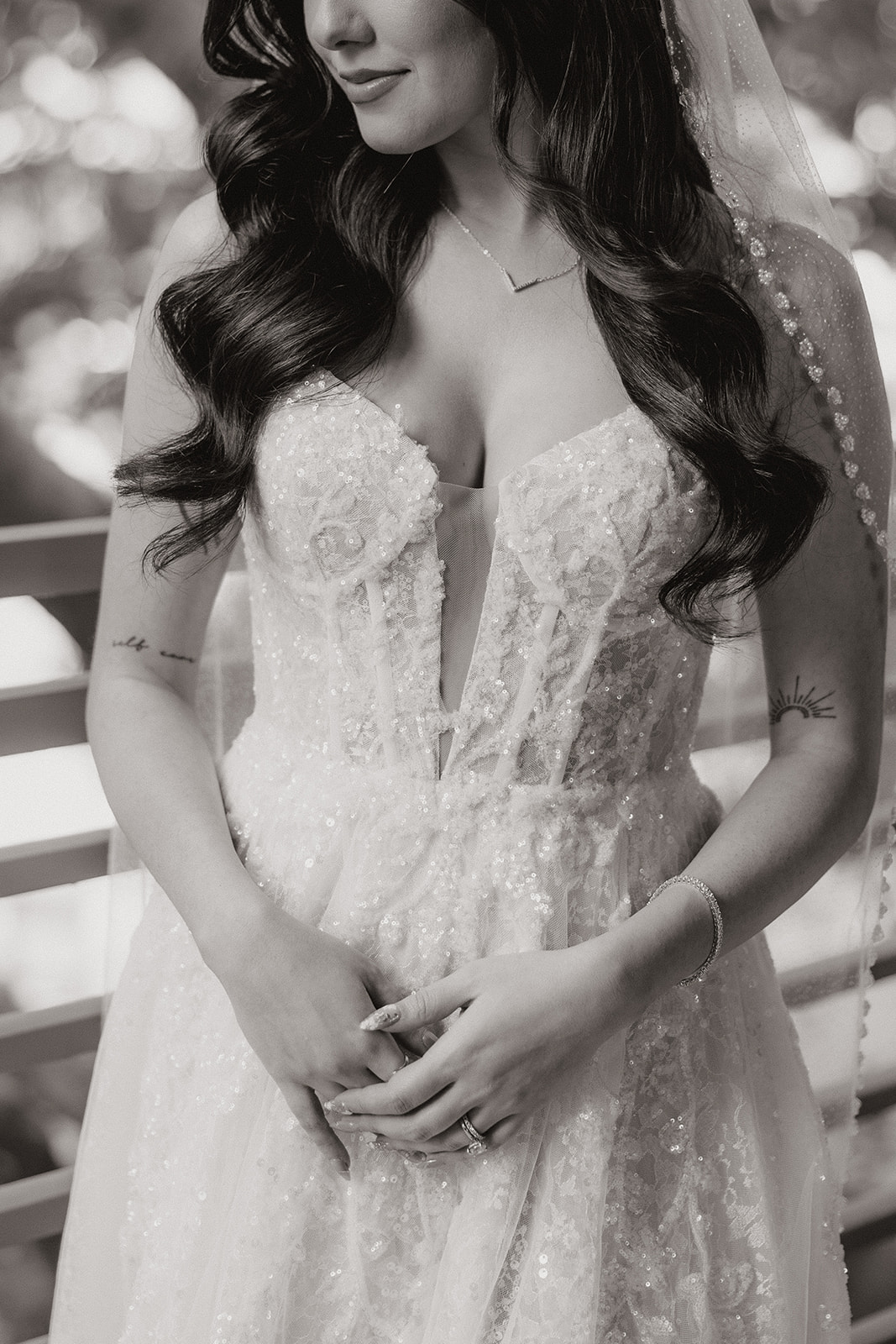 Close-up of the bride’s dress bodice and details in a black and white portrait
