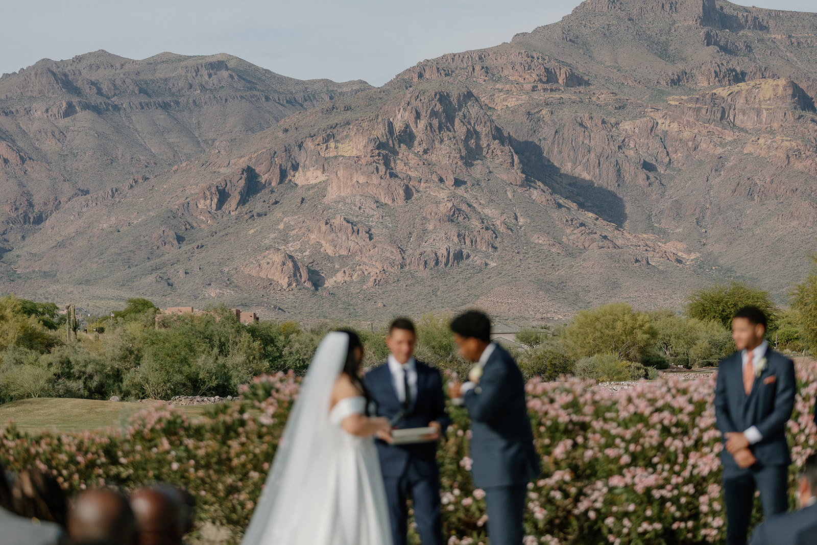 ceremony moment with mountains in background during gold canyon golf resort wedding