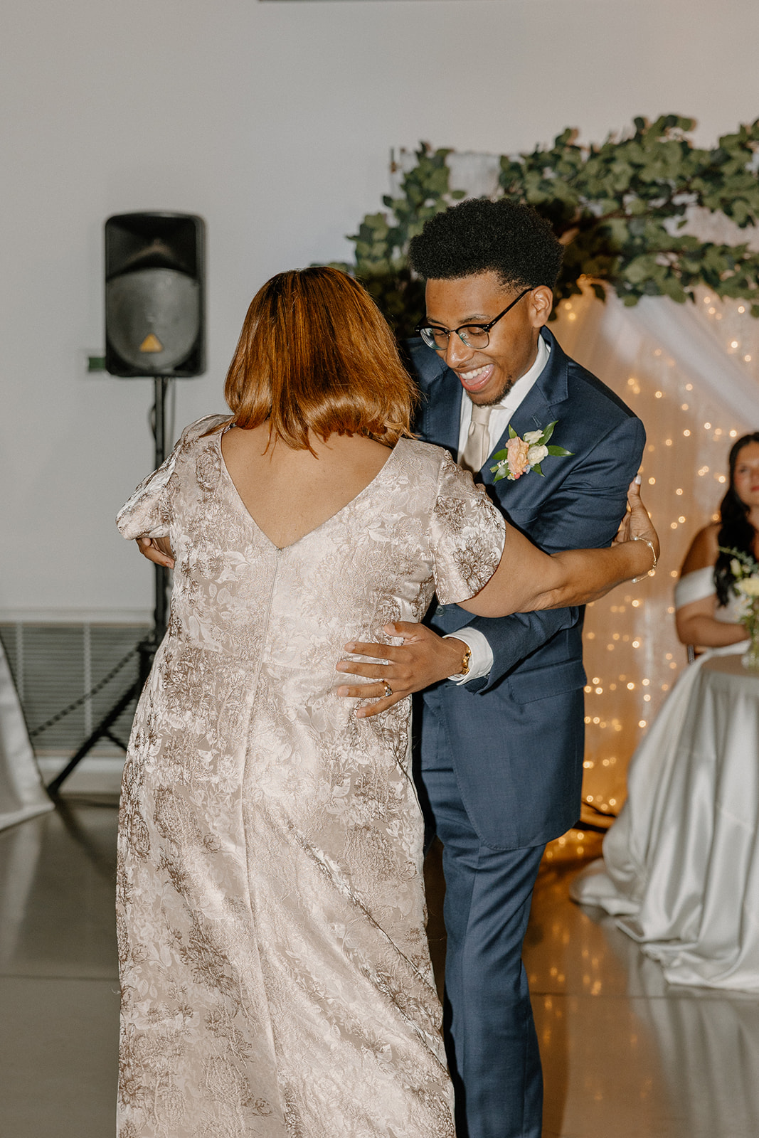 groom dancing with family member during reception at gold canyon golf resort wedding