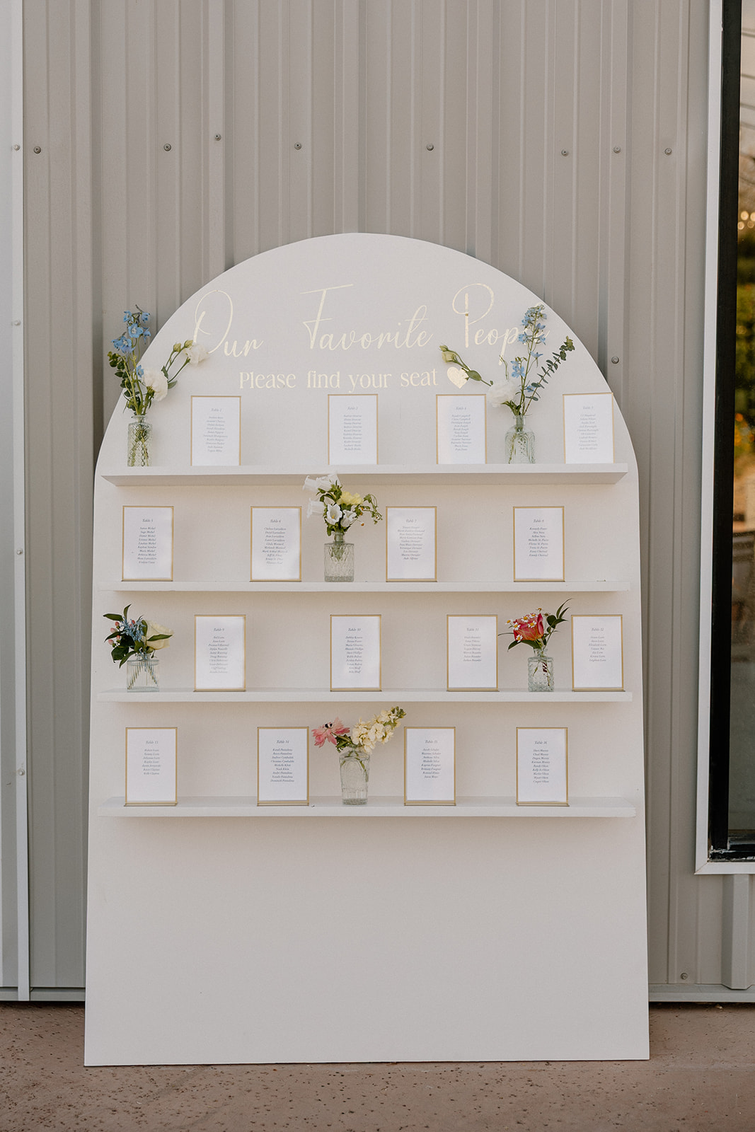 seating chart display with floral accents set up at gold canyon golf resort wedding