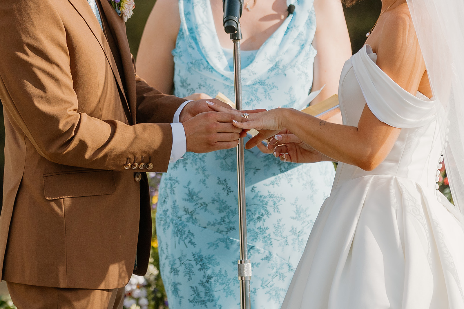 a bride and groom exchanging rings during their wedding