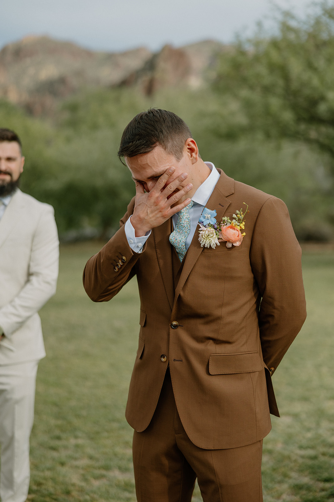 A groom's reaction to his bride walking down the aisle
