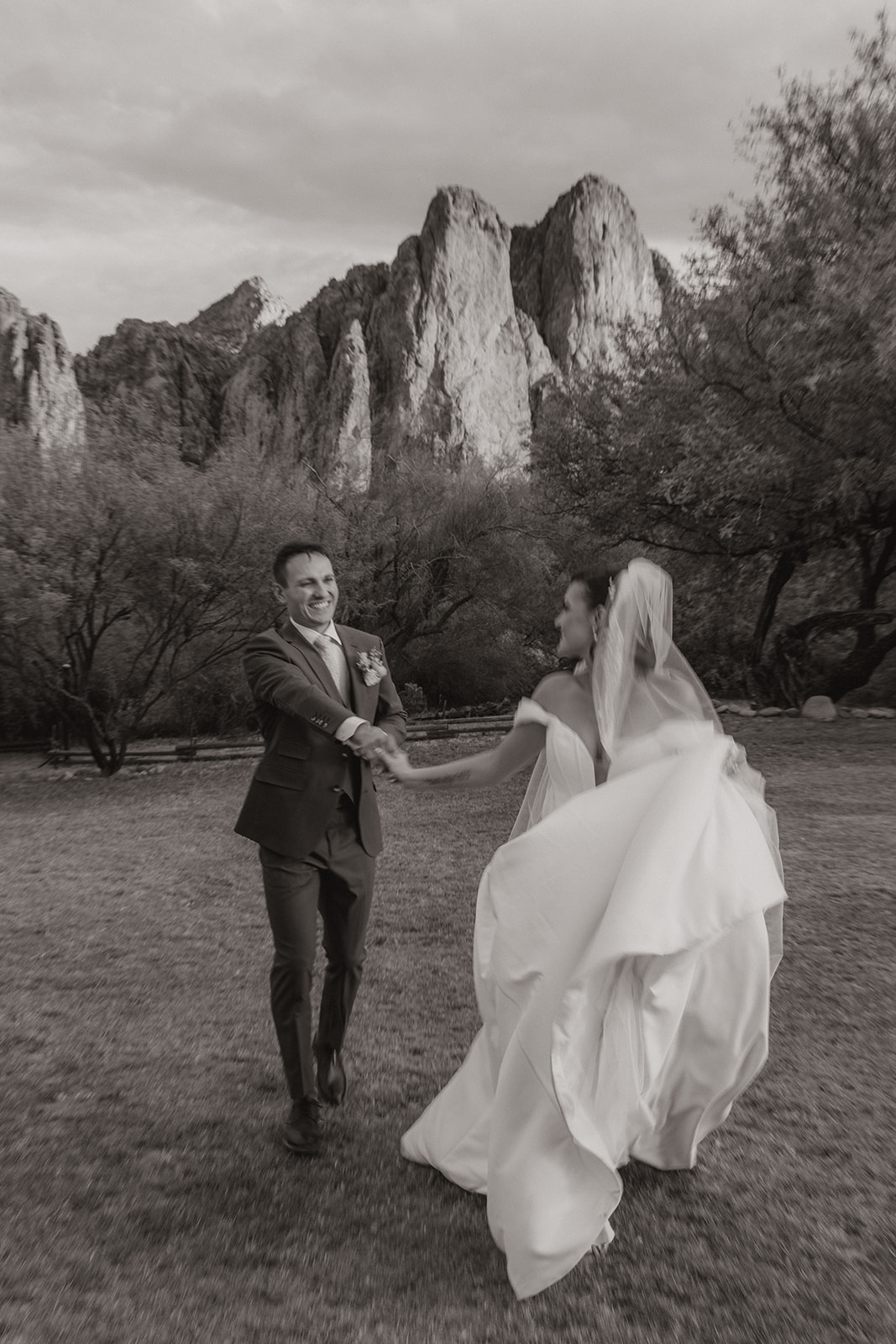 A black and white photo of a bride and groom