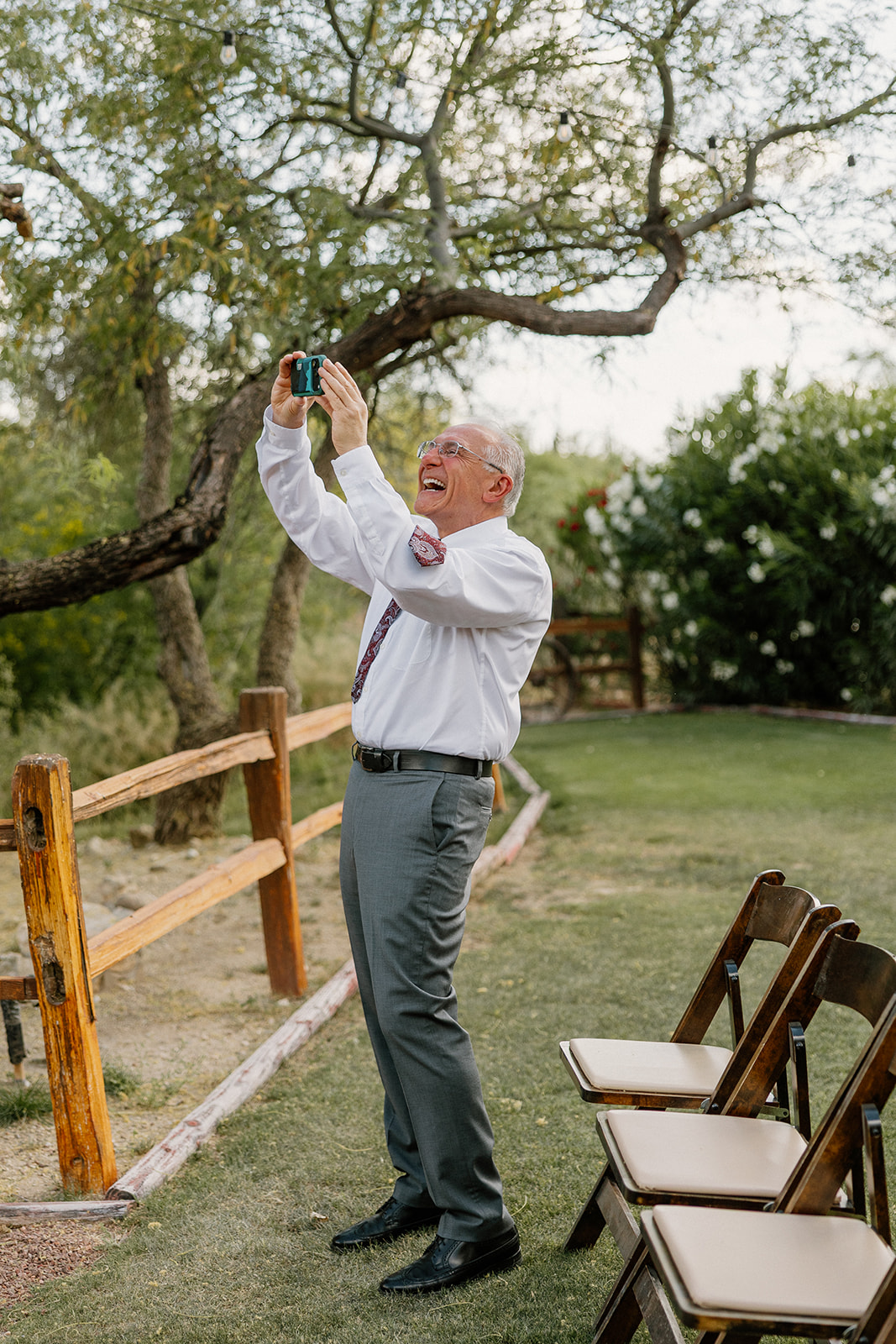 A man taking photos of a wedding ceremony at Tanque Verde Ranch