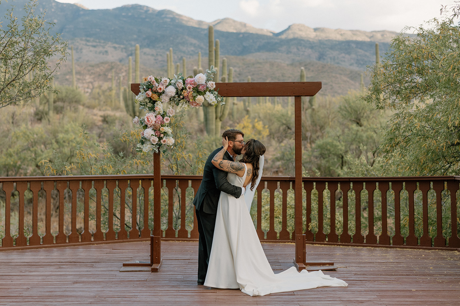 A bride and groom's first kiss at their intimate wedding at Tanque Verde RAnch