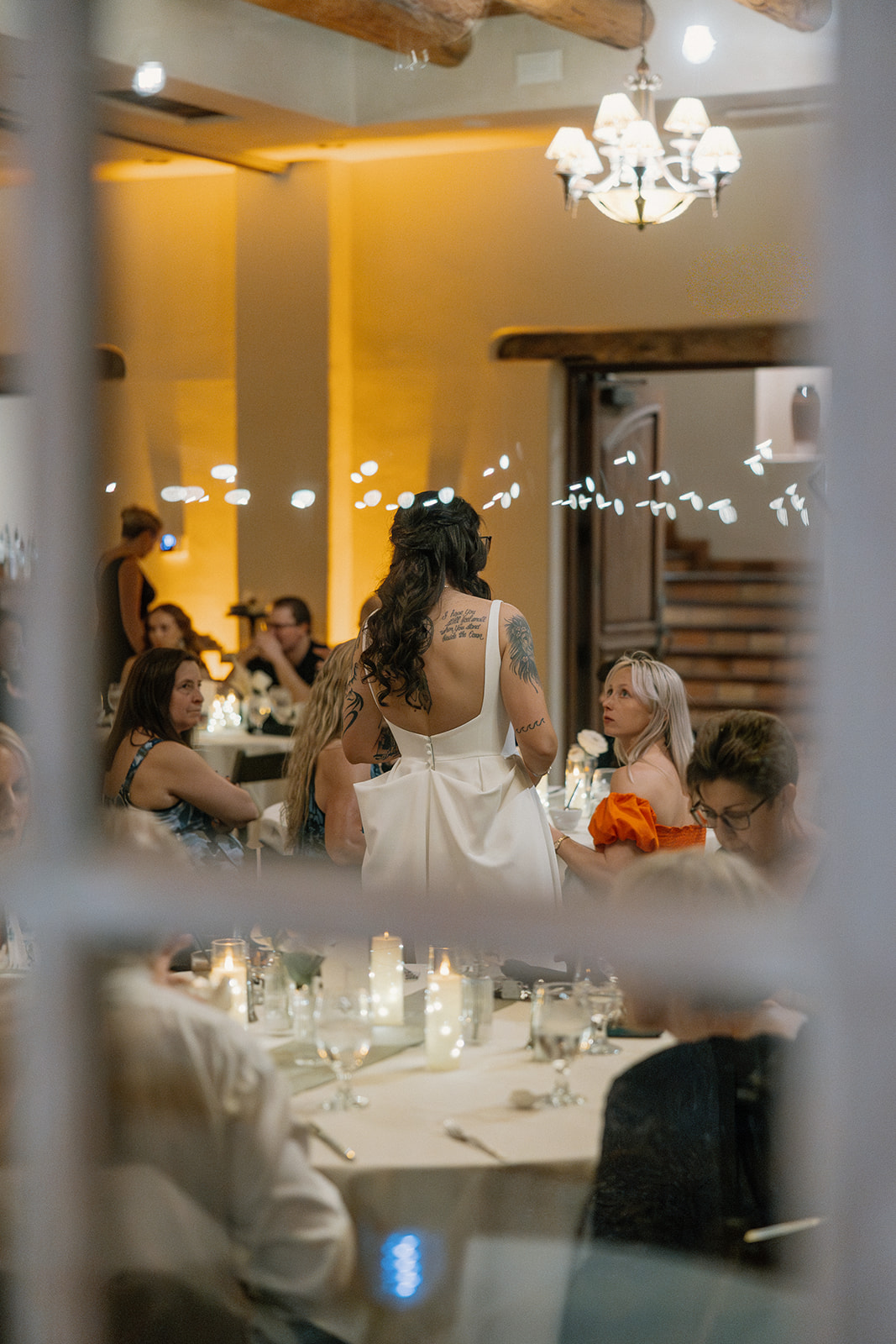 A bride talking to guests at her wedding reception