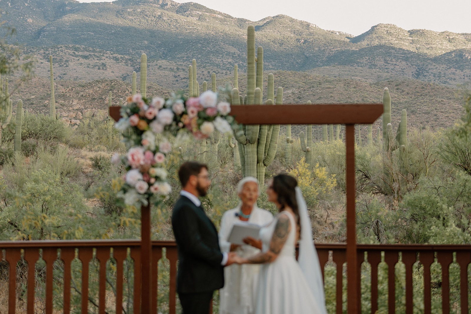 A bride and groom during their wedding ceremony at Tanque Verde Ranch