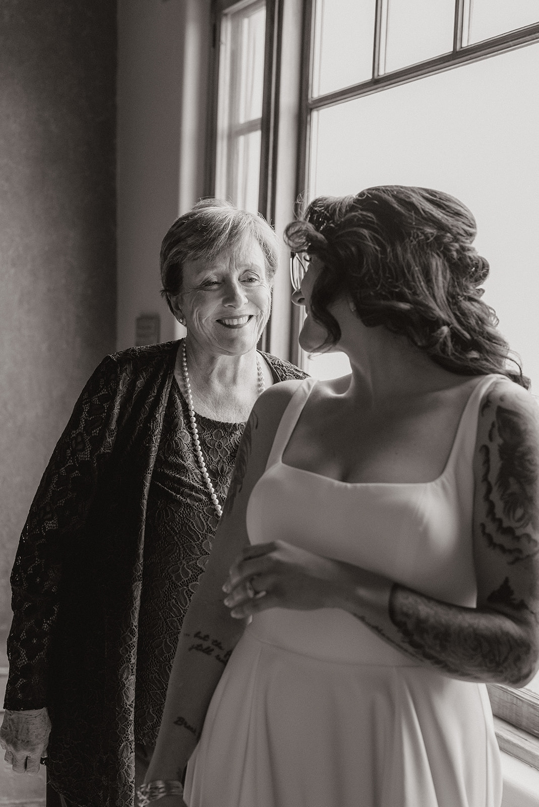 A bride getting ready for her wedding with her mom