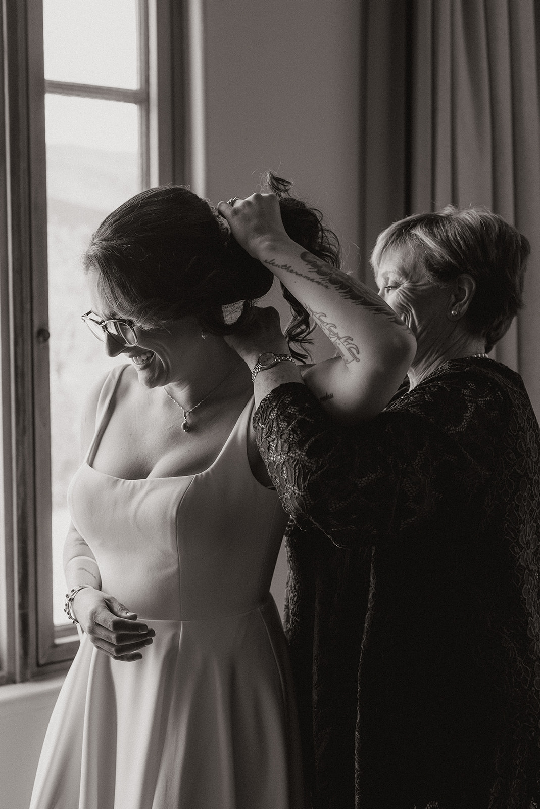 A bride getting ready for her wedding with her mom