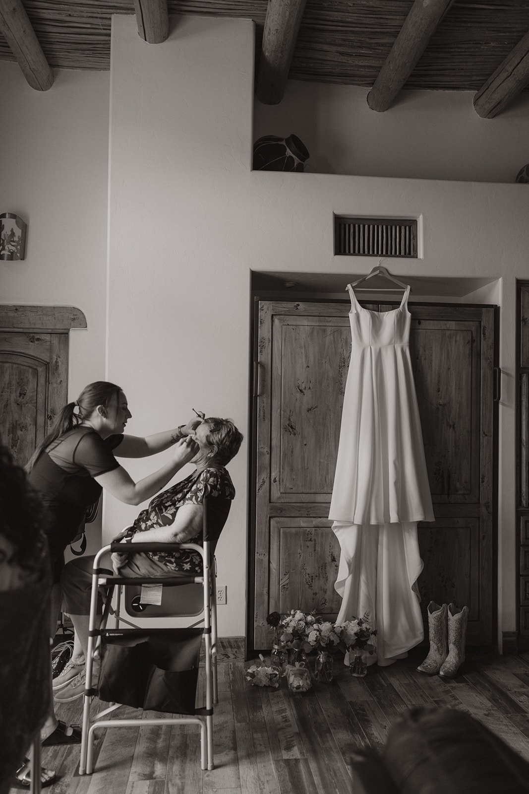 A bride getting ready for her wedding with her mom