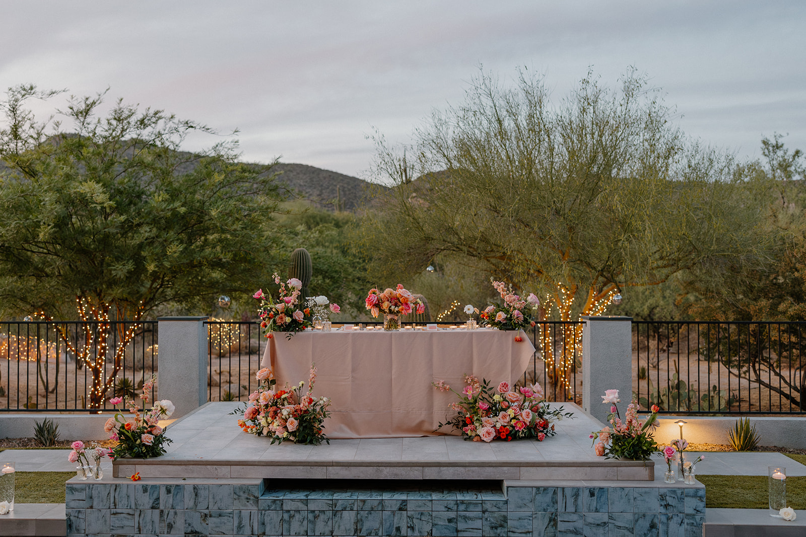A sweetheart table set up at a backyard wedding